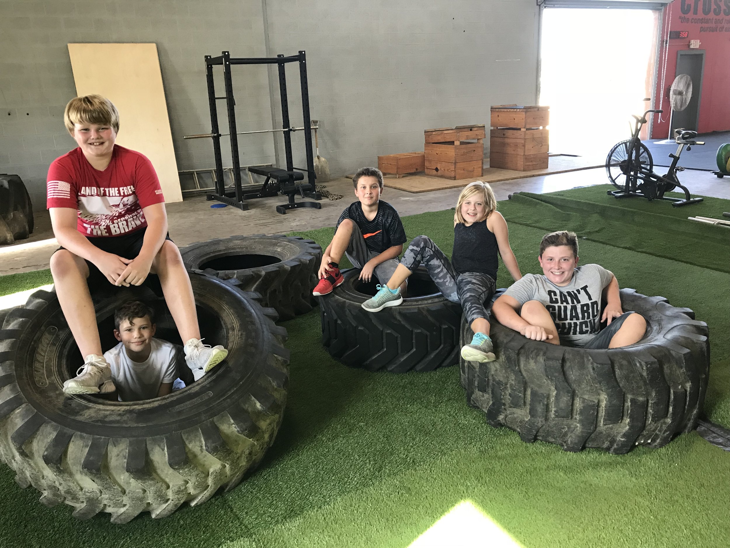 CrossFit Kids relaxing after a good workout!