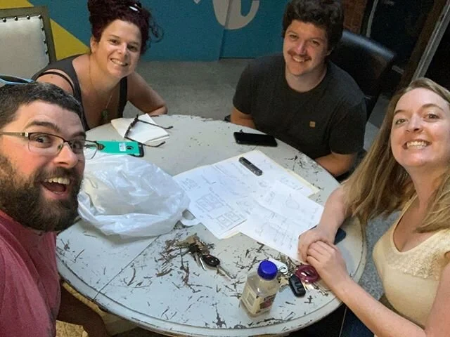 With the new regulations of &quot;pods&quot; and gatherings, our game development team has been able to resume their weekly in-person meetings!

These four have the genius brains that create our games, and between the four of them, they have a background in set design, puzzle design, construction, UX development, programming, event planning, game design, haunted house design, and electrical (and more!). There are two others that are a part of this core team, who are currently working on different projects. 
They're currently grinding hard to develop a brand new game. Our games take months (and sometimes over a year) to develop from start to finish. We never want to put out a product we aren't proud of, so with new games we take our time and try not to rush the development. We've learned the hard way many moons ago, that rushing games leads to games that aren't as fun (or well designed)! We have so much love for our team and our improbable little family! (L-R: Adam, Devon, Iain, Emma) - 
#gamedeveloper #gamedev #unity #gamedevelopment #d #ygk #game #programming #kingston #kingstoncanada #ygk #kingstonontario #visitkingston #on #downtownkingston #ygklove #ygkevents #ygkbiz #queensuniversity #queensu #stlawrencecollege #escaperoom #escape #escapegame