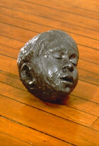 lead head, 1999 cast lead, 23 x 19 x 24 cm.
