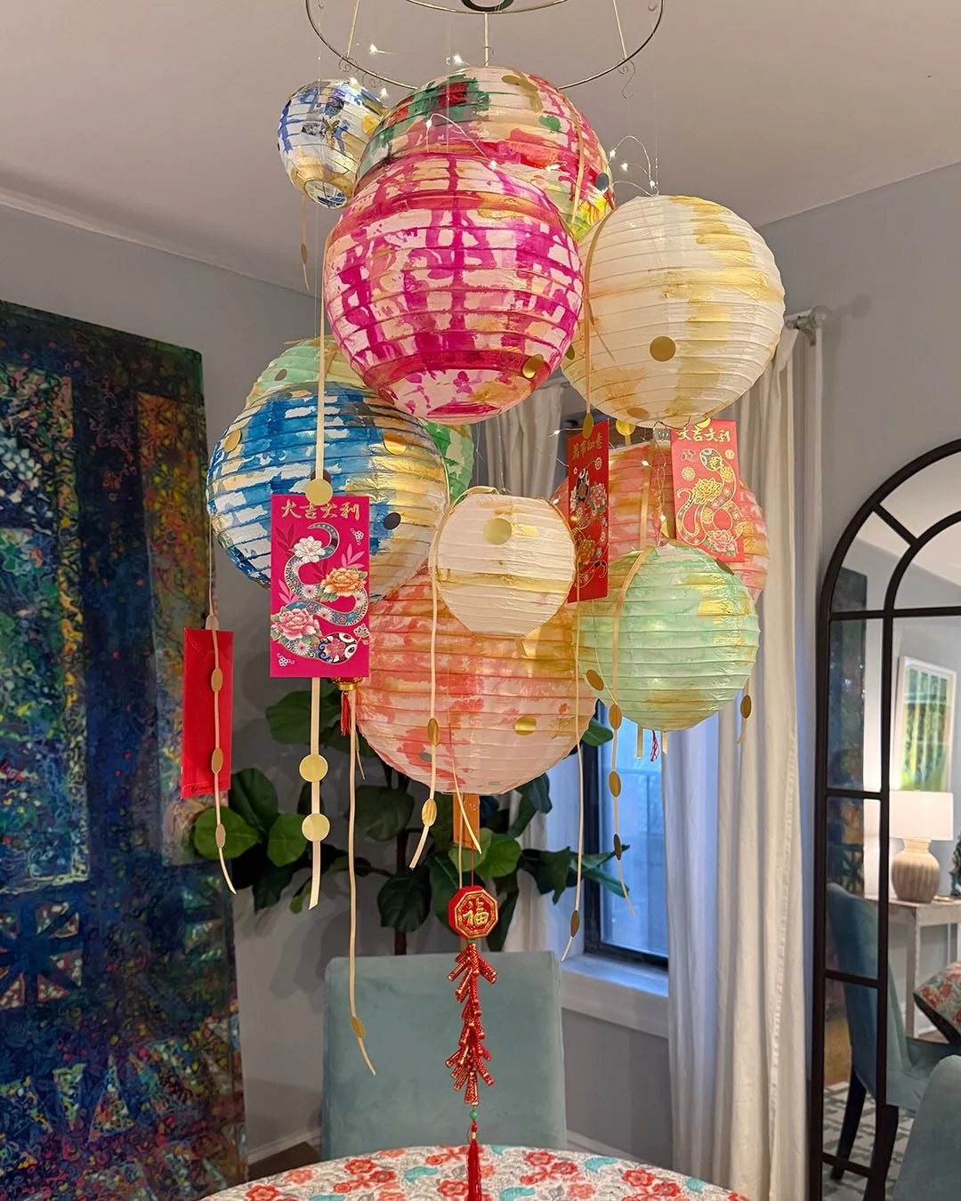 Lantern Installation for the New Year

This installation marks the turning of the lunar year. Eleven hand-painted lanterns form a suspended field above the table&mdash;an offering to continuity, nourishment, and creative labor.

Five red envelopes ha
