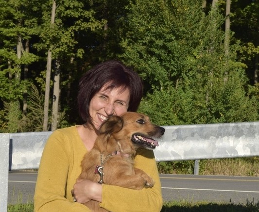 INDIANA NASH/GAZETTE REPORTER Joni Bonilla, founder of Operation At Ease, poses with Glory, who was recently rescued. Monday, Sept. 12, 2016.