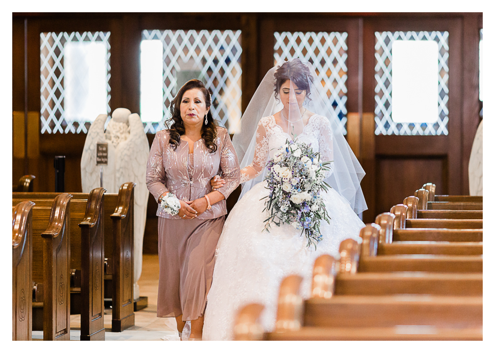 bride-walking-down-aisle-with-mom-catholic-wedding-holy-trinity.jpg