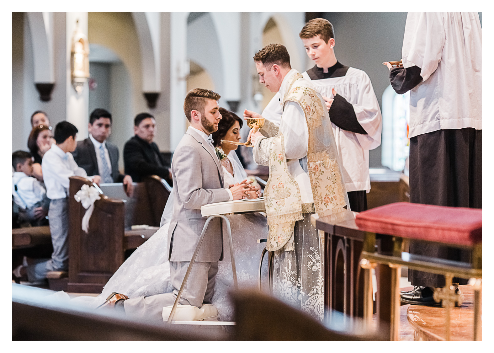 catholic-wedding-holy-trinity-manassas-virginia-communion-groom-receiving.jpg