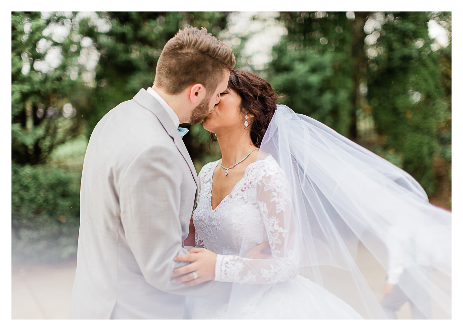 foxchase-manor-wedding-bride-groom-portraits-kissing.jpg