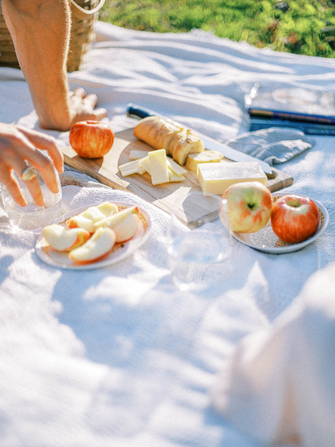 cheese-and-baquette-on-olive-wood-board-during-fall-picnic-in-virginia.jpg