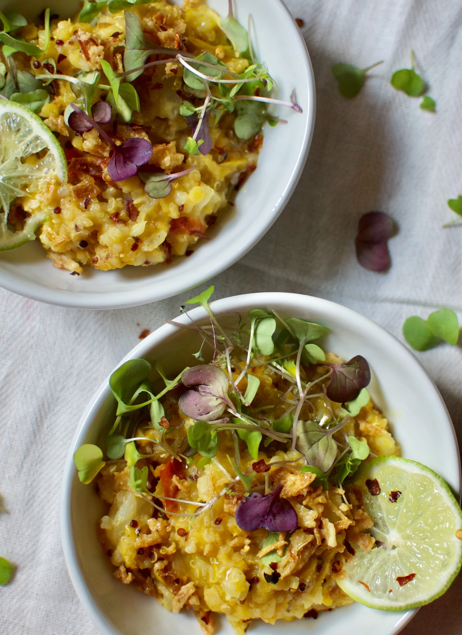 a bowl of khichuri with warm ghee & fresh limes
