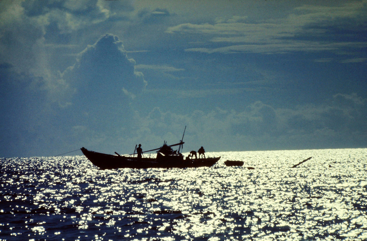 Vietnamese fishermen heading out in their sampan to the South China Sea from the port in Nha Trang, Vietnam Michael Olson — U.S. Army, Specialist 4, 981st M.P. Sentry Dog Nha Trang, Vietnam 1969-70
