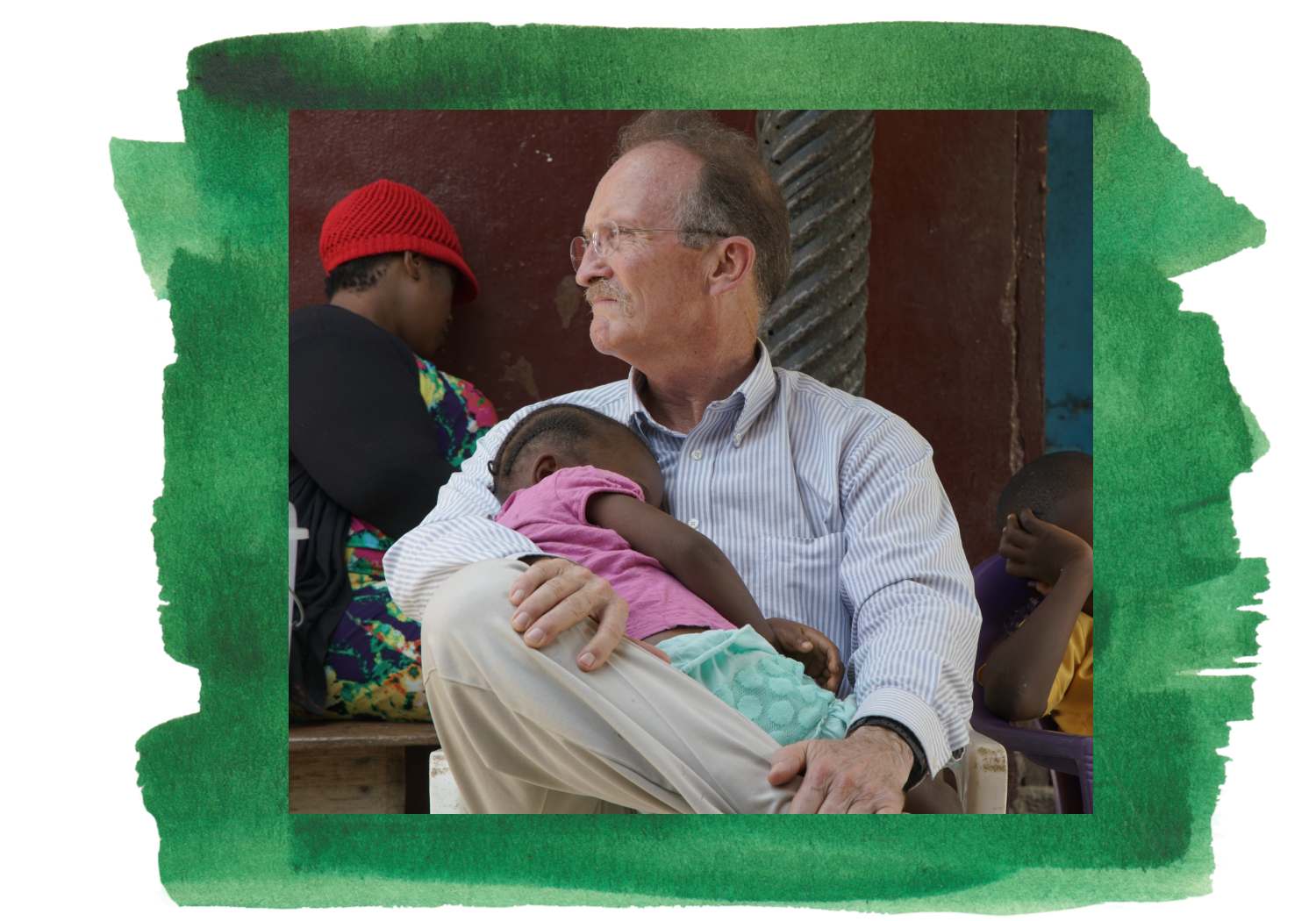 Peace Corps volunteer Dr. Kevin Rodgers holds a sleepy child during filming in Liberia.