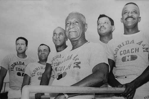 Vintage photo of Gaither with his coaching staff.
