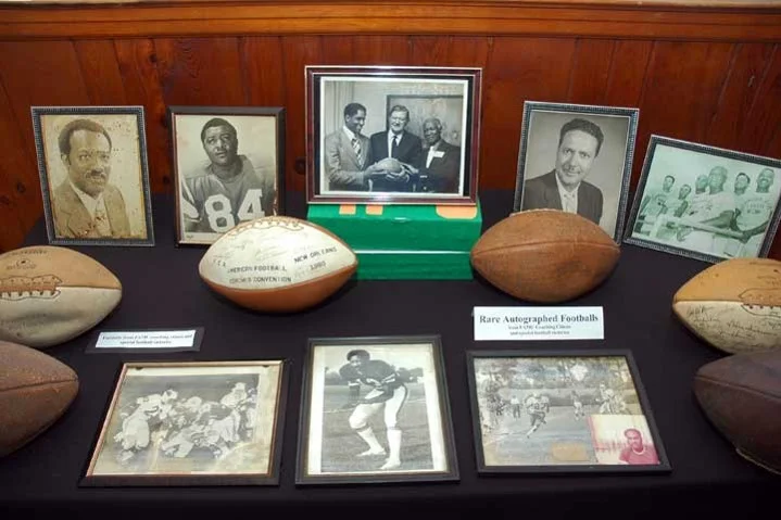 Exhibit of historic pictures, autographed footballs, and other memorabilia.