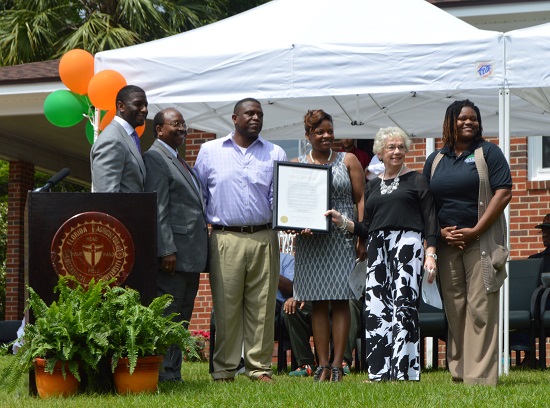 Pictured from left to right is: City of Tallahassee Mayor Andrew Gillum; City Commissioner Curtis Richardson (Seat 2); and marker sponsors Cornelius and Reché Jones (owners of the home); Niki P. Joyce (longtime friend of Coach Gaither); and LaTanya White, assistant professor of marketing at Florida A&M University.