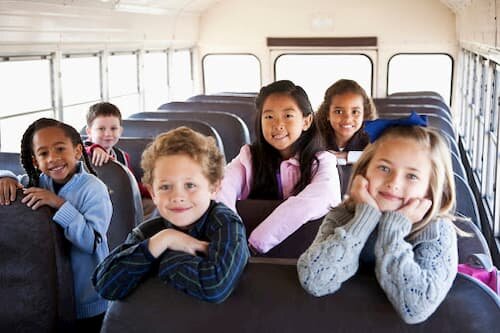 Happy Kids inside School Bus
