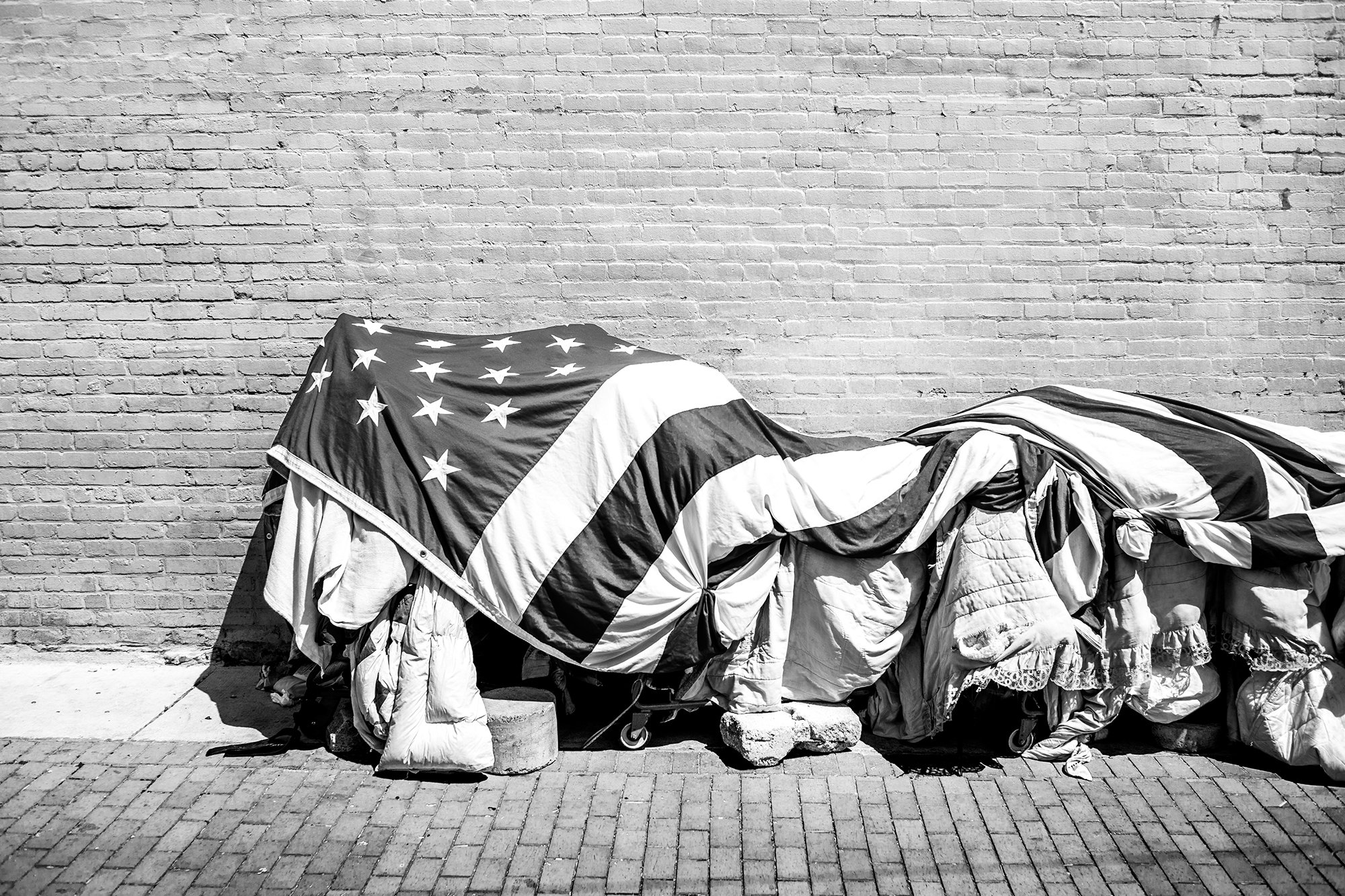 Homeless Person using an American Flag to protect their belongings, Washington DC, USA