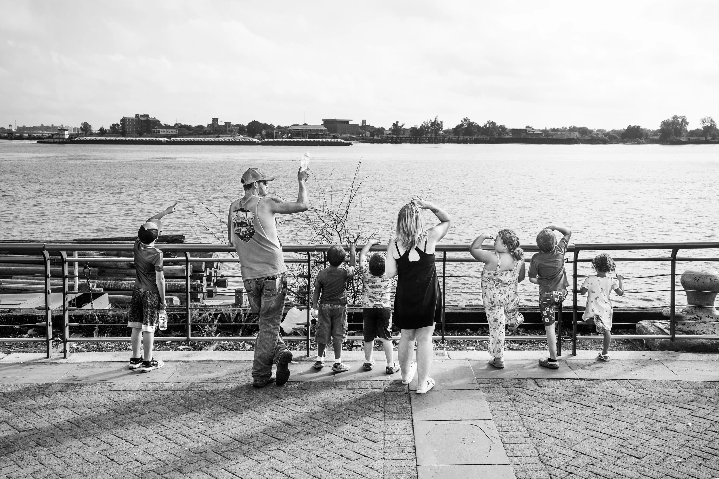 Large family looking at the Mississippi river, New Orleans, Louisiana, USA