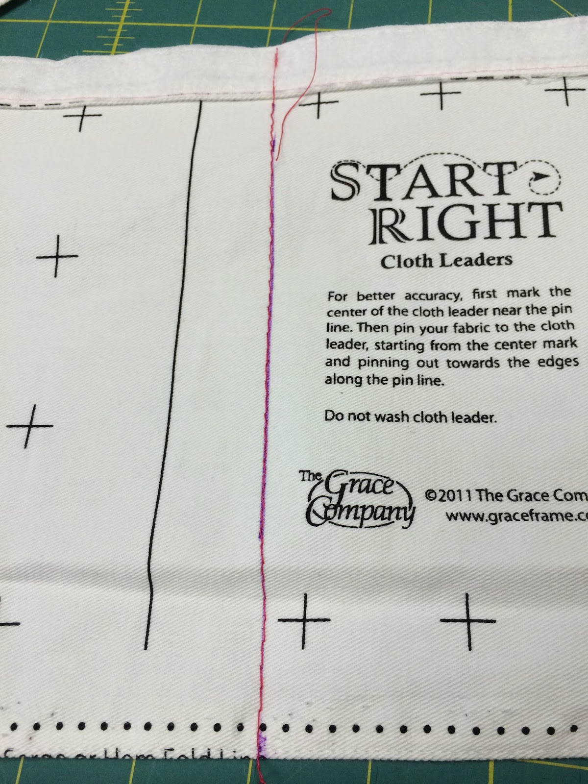 Wind a bobbin in red and using the same red thread on the top stitch on the line you have just drawn. Straight stitch with small stitches works best.