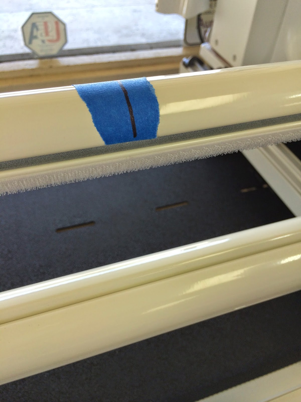 Shop frame showing the painters tape with center line marked.