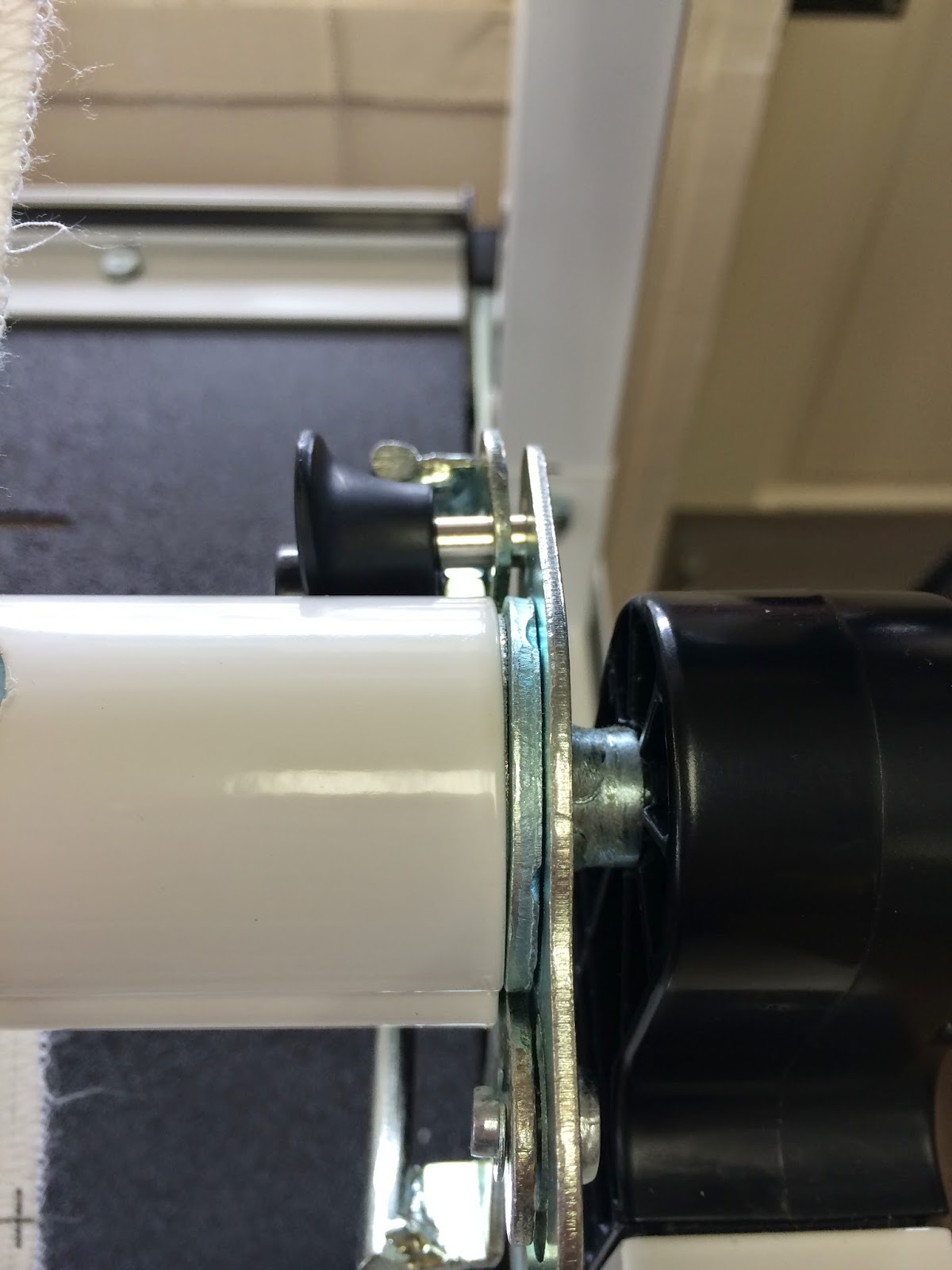 Close up of the locking mechanism on the Momentum frame. Black lock with silver pin will lock in place to close.