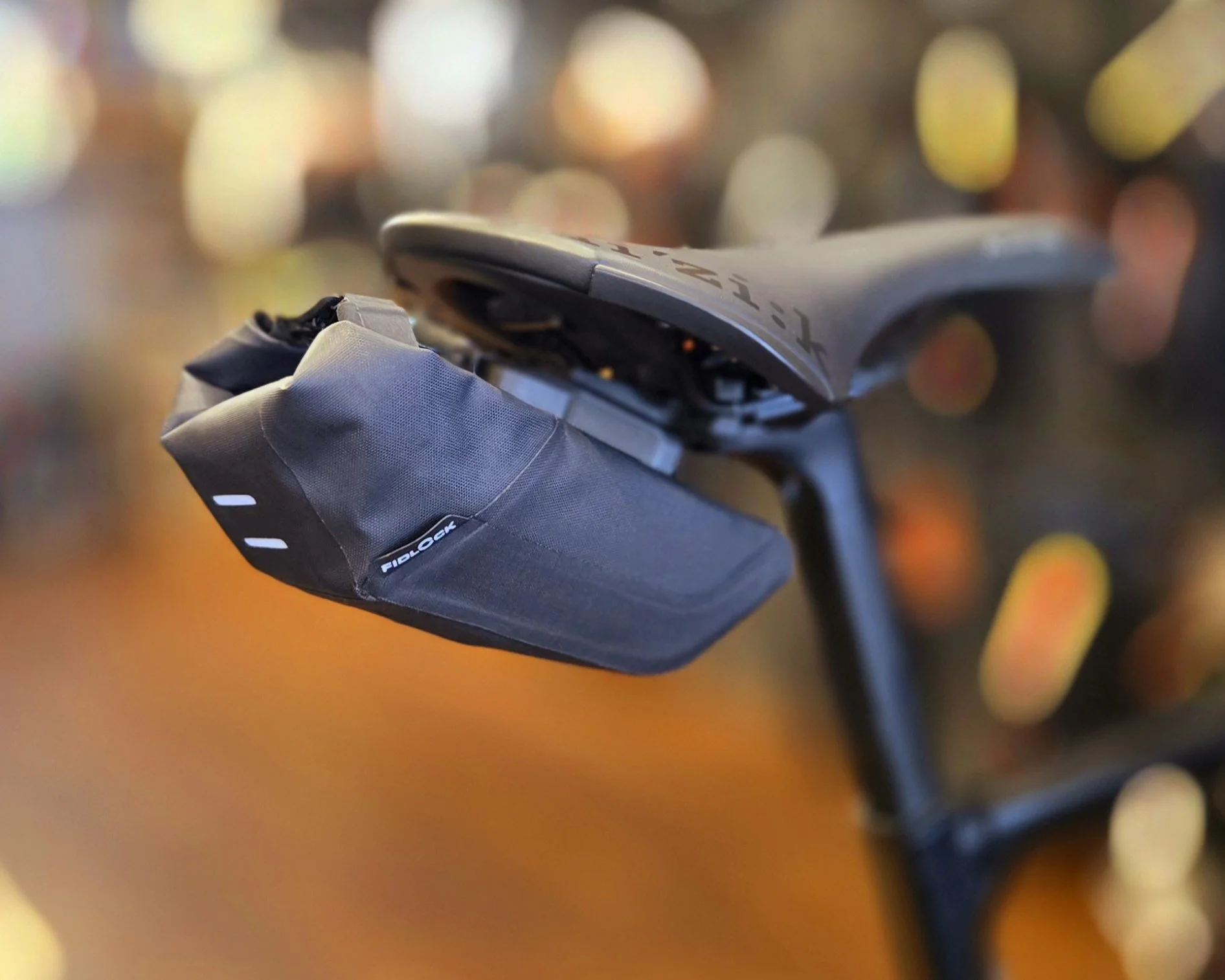  Fidlock Saddle Bags allow for minimalist content and can be taken on and off the bike without tools.  