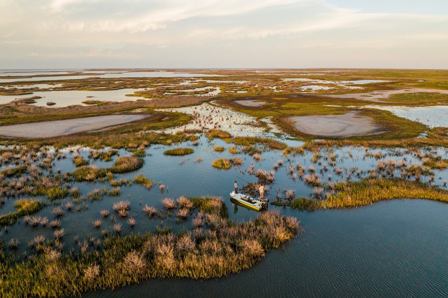From above, it&rsquo;s a scene that never gets old&mdash;marsh winding like veins through the flats, and a lone poling skiff creeping along the shoreline. Every shadow, every ripple could be a Redfish. This is the art of the hunt&mdash;sight fishing 