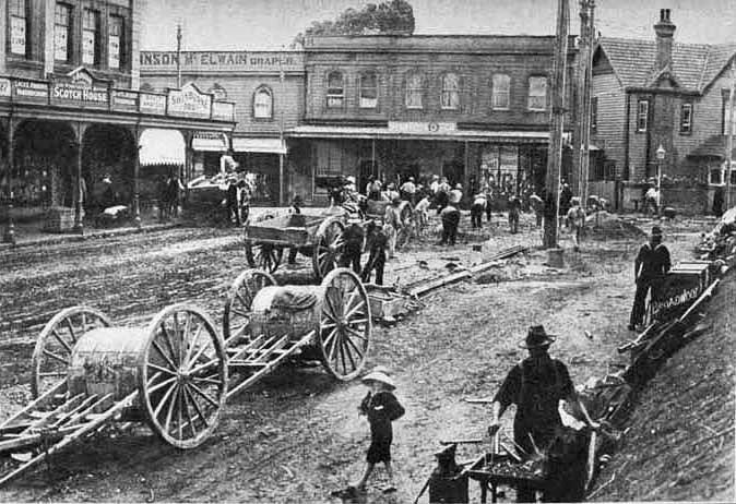 TRAMS ARRIVE: Laying tram lines near the corner of Mount Eden Road and New North Road, Eden Terrace in 1908 (Photo: Sir George Grey Special Collections, Auckland Libraries, 7-A4972)
