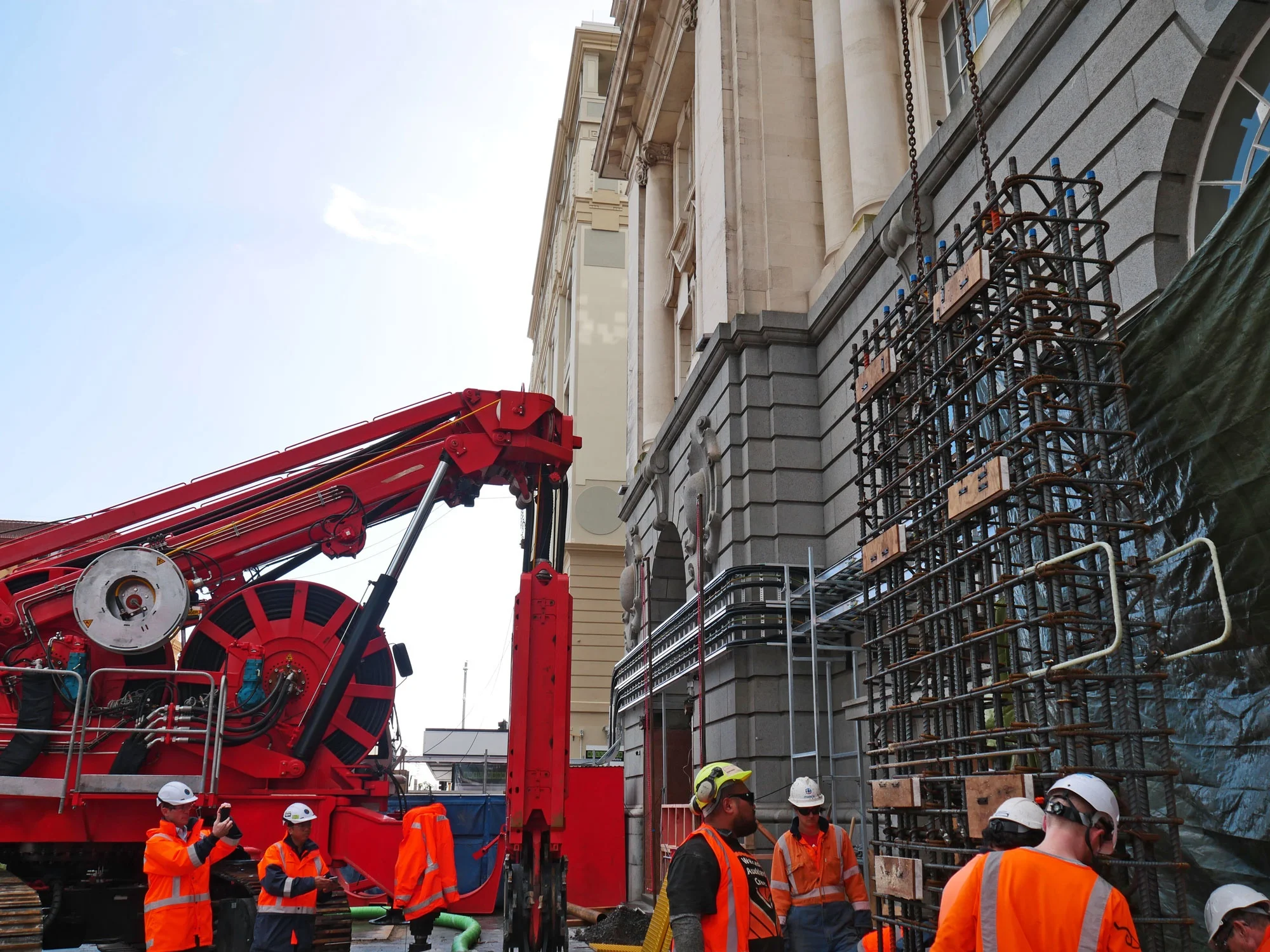 CRL construction work in Lower Queen Street. This bright red 90 tonne piling rig named Sandrine worked inside and outside the historic Chief Post Office (Britomart Transport Centre) building until being returned to France in early 2018.