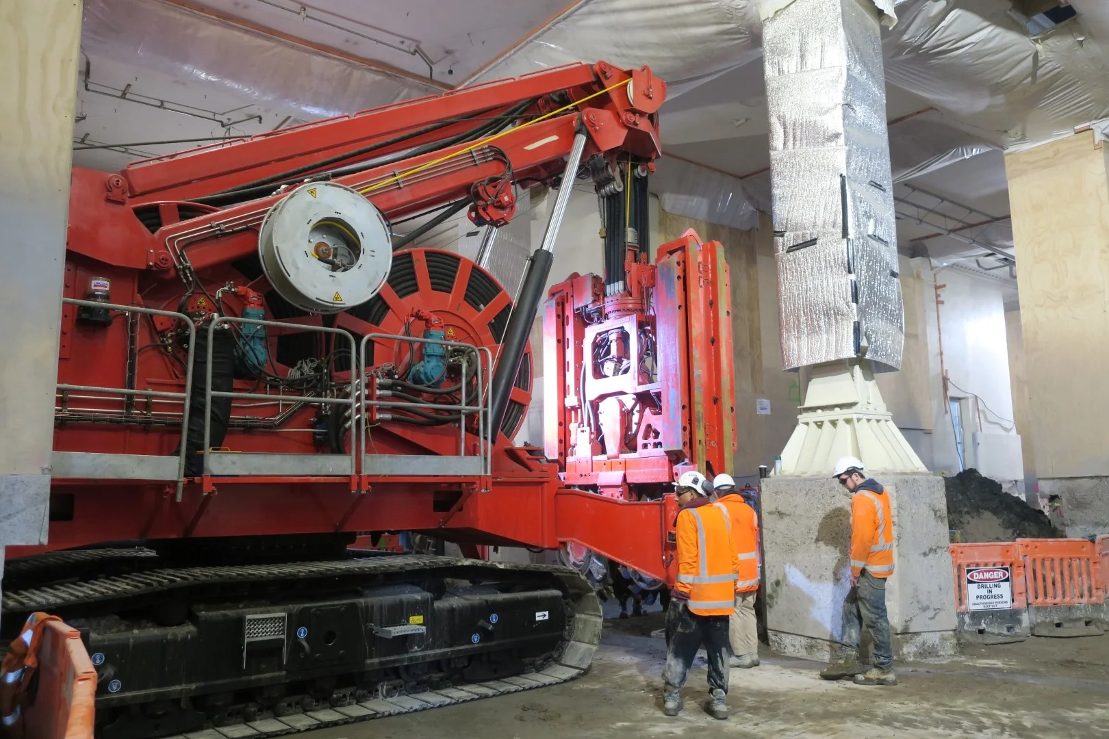 This bright red 90 tonne piling rig named Sandrine worked inside the historic Chief Post Office (Britomart Transport Centre) building until being returned to France in early 2018.