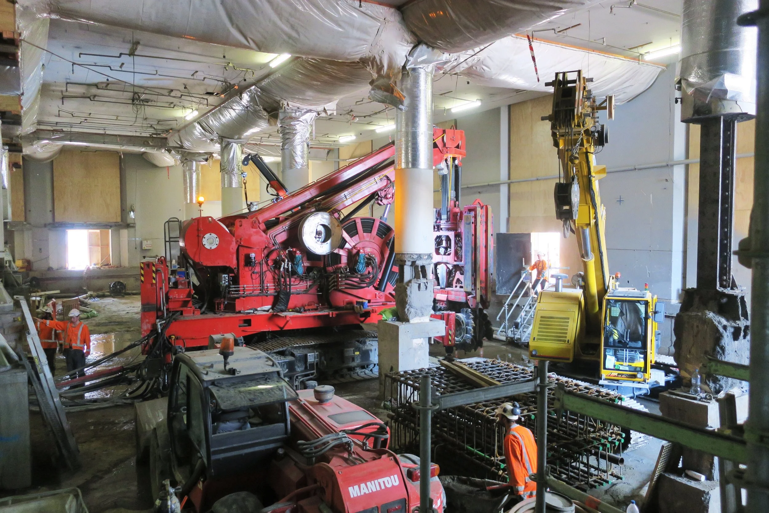 Inside the CRL construction in the Chief Post Office December 2017. This bright red 90 tonne piling rig named Sandrine worked inside and outside the historic Chief Post Office (Britomart Transport Centre) building until being returned to France in early 2018.