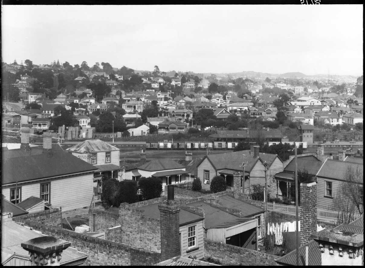   HOW IT WAS: How Mt Eden train station looked in 1931. This view is looking south from the roof of Trucks Limited in New North Road (formerly Eden Crescent) across Mount Eden, showing Flower Street, (left to right across foreground), railway lines a