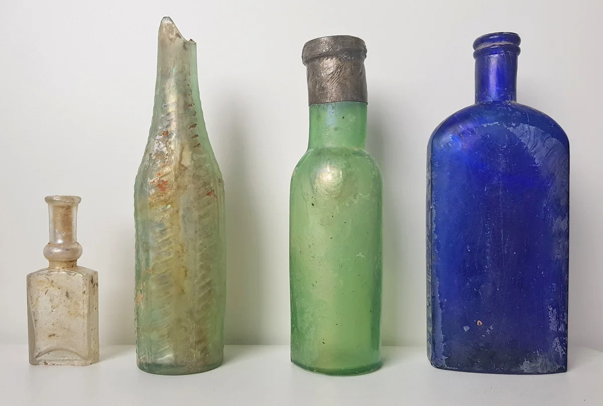 BOTTLES: (from left to right) Rimmel perfume bottle, condiment/food bottle, salad oil, the Mexican hair renewer
