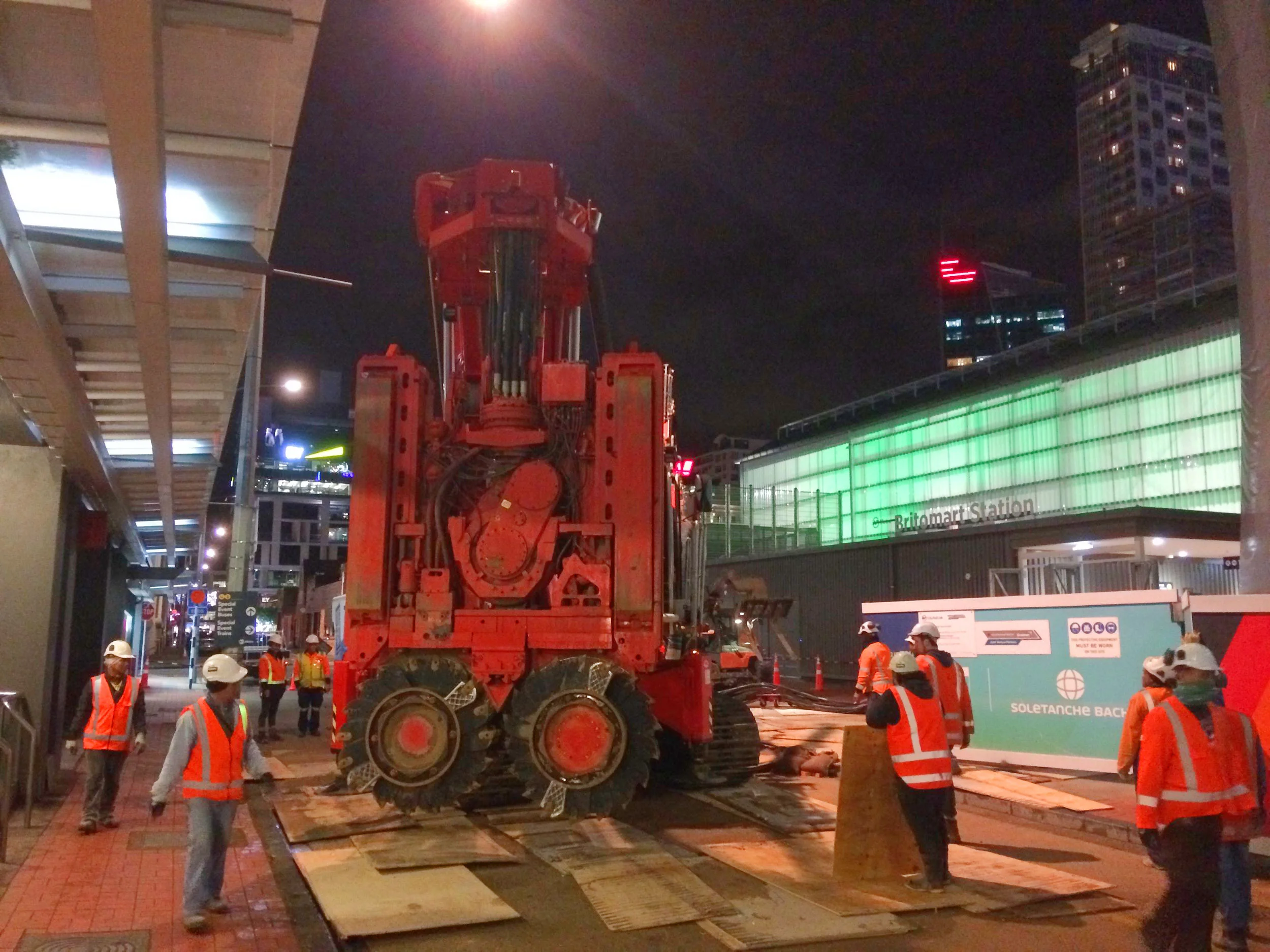 This bright red 90 tonne piling rig named Sandrine worked inside and outside the historic Chief Post Office (Britomart Transport Centre) building until being returned to France in early 2018. This is Sandrine being brought inside the building August 2017.