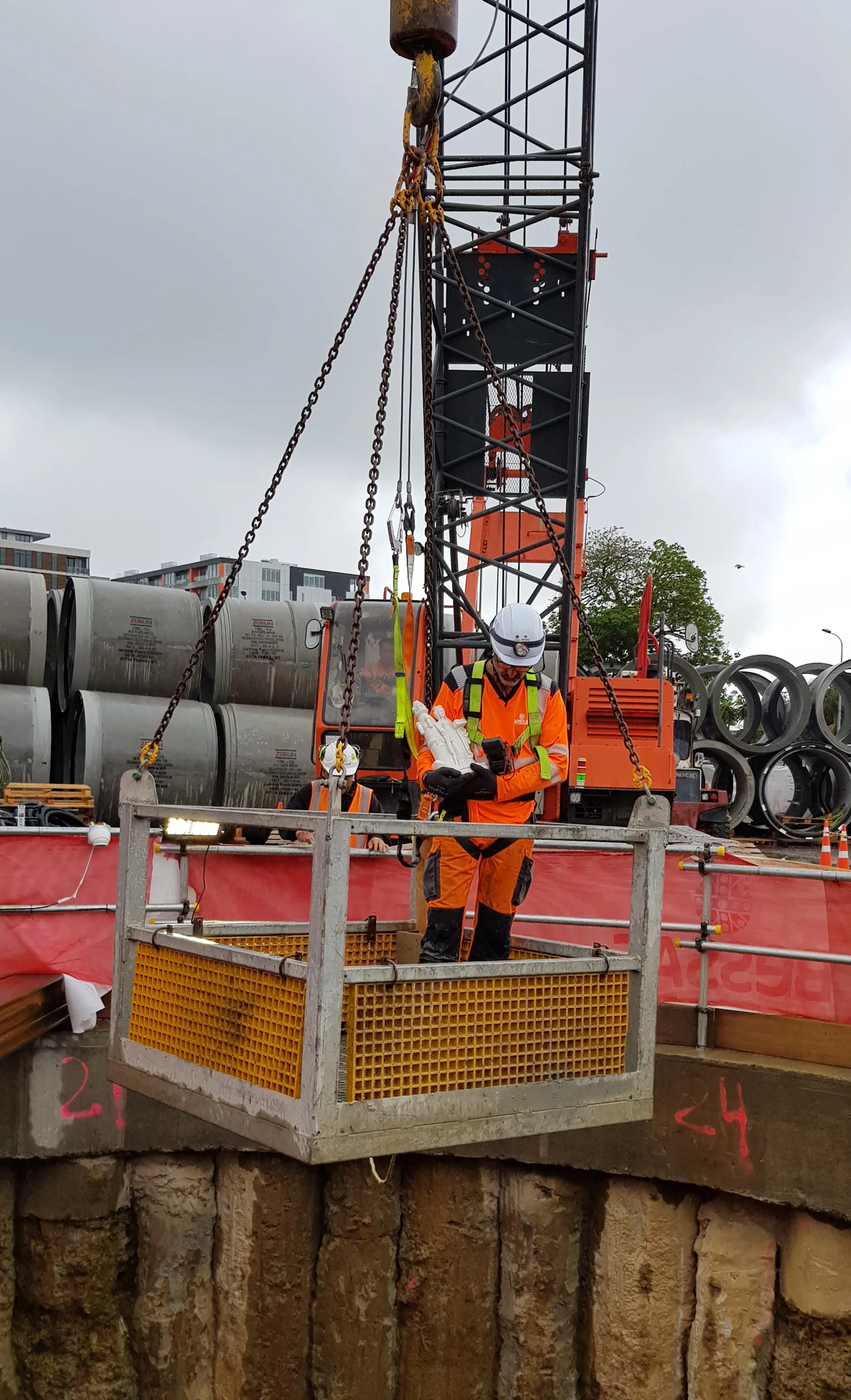 Statuette of St Barbara, the patron saint of miners and tunnellers is carried by MBJV tunnel supervisor Laurent LeCalvez down the CRL shaft at Mt Eden where tunnel boring machine Jeffie will be used to help divert a section of the existing Mt Eden stormwater pipe, which will be in the way of the CRL tunnel.