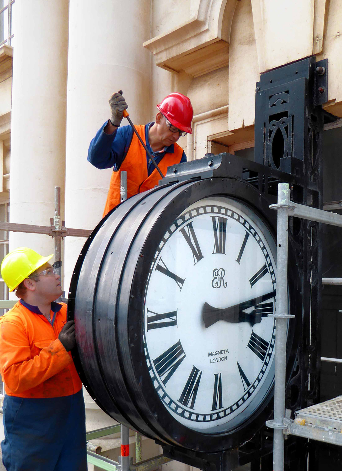   CLOCK: The CPO clock being carefully removed for restoration  