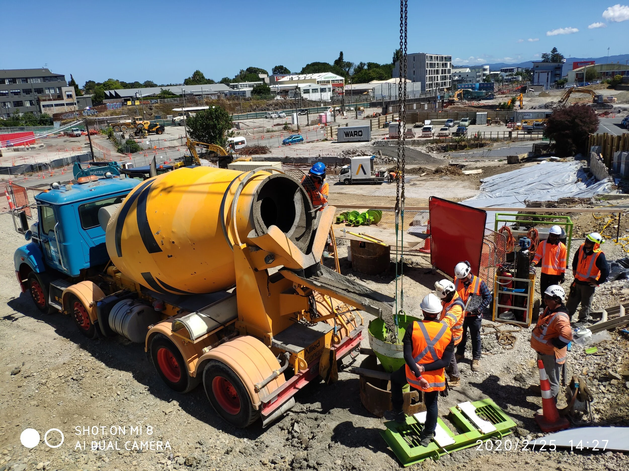  Mt Eden Feb 2020 Construction workers pouring concrete into a caste that will form a portal pile. 