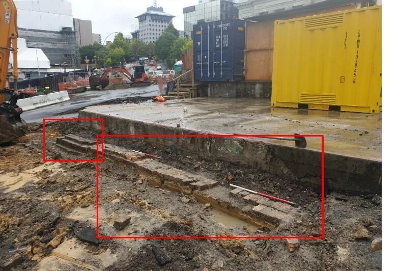  Around the Aotea Station work, in the vicinity of the corner of Wellesley Street and Mayoral Drive, crews uncovered remains of the old Salvation Army Hall that was there.  Uncovered were several brick foundations walls, two drains and a brick pile. 