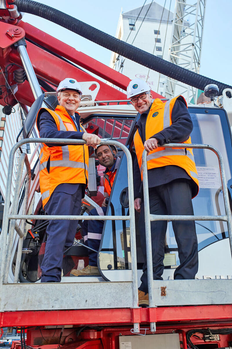 Transport Minister Phil Twyford and Mayor Phil Goff and Phil Twyford stand on Sandrine at Aotea Station site