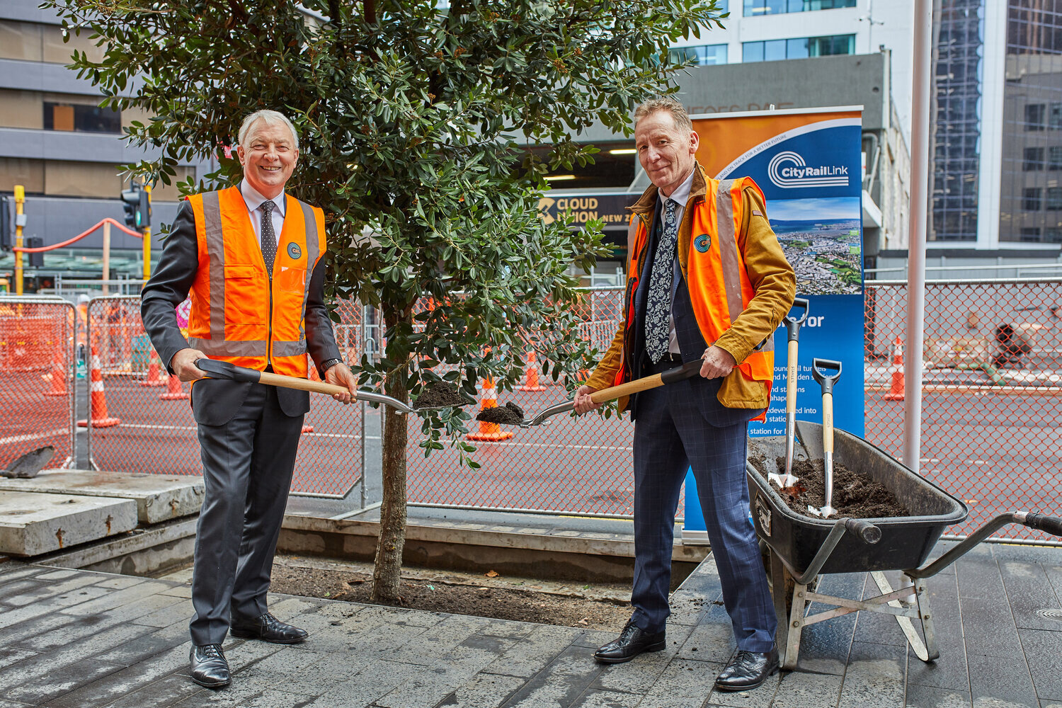 Auckland Mayor Phil Goff, left, and City Rail Link Chief Executive Dr Sean Sweeney planted the first pohutukawa.