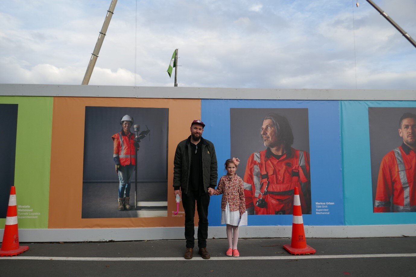  Artist Mark Barber and his daughter in front of his art titled:  Cadre.  