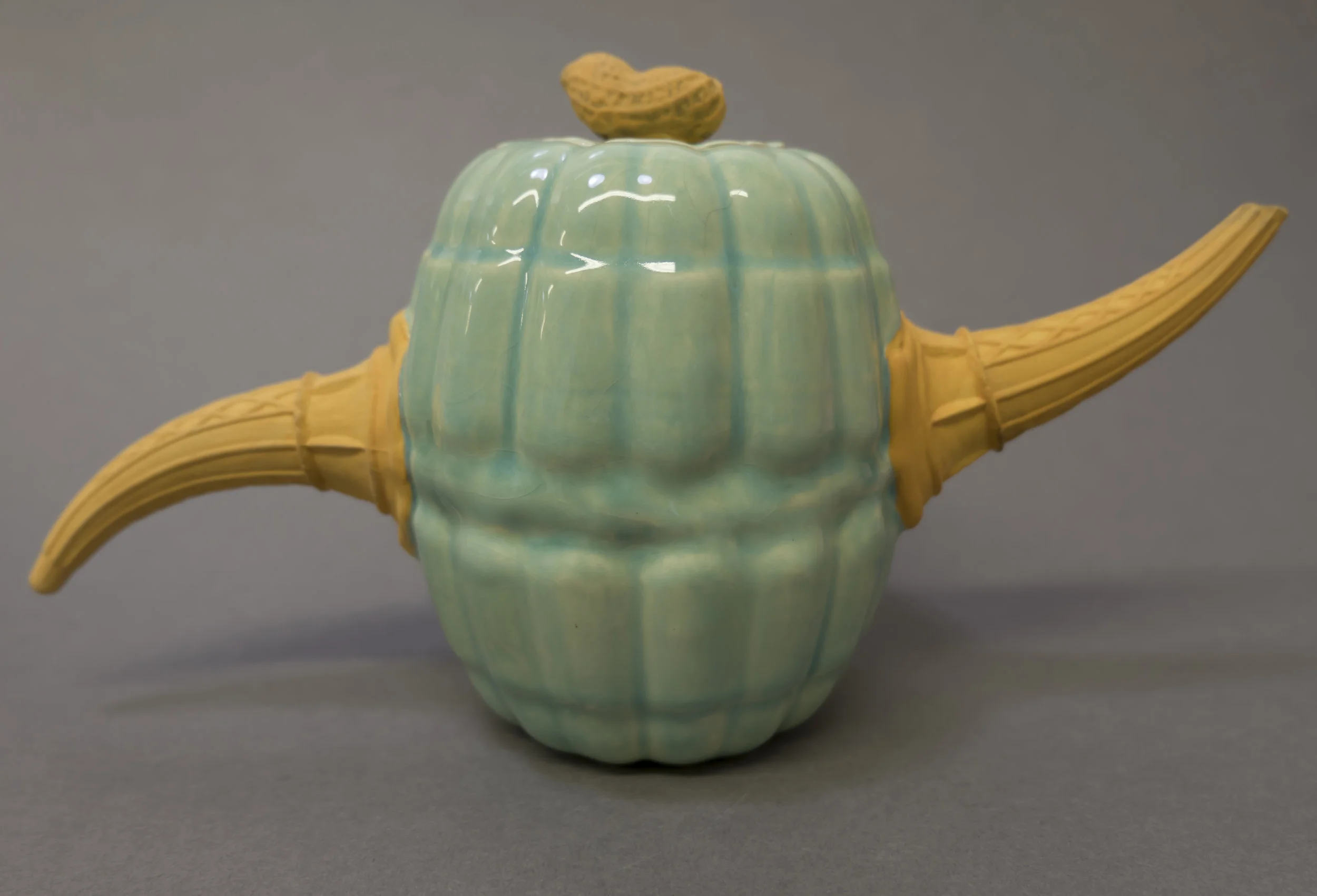 Semi-Porcelain slip cast teapots. Made from casts of peanuts, jelly molds, and ice cream cones. Pours like an old man with prostate problems. 