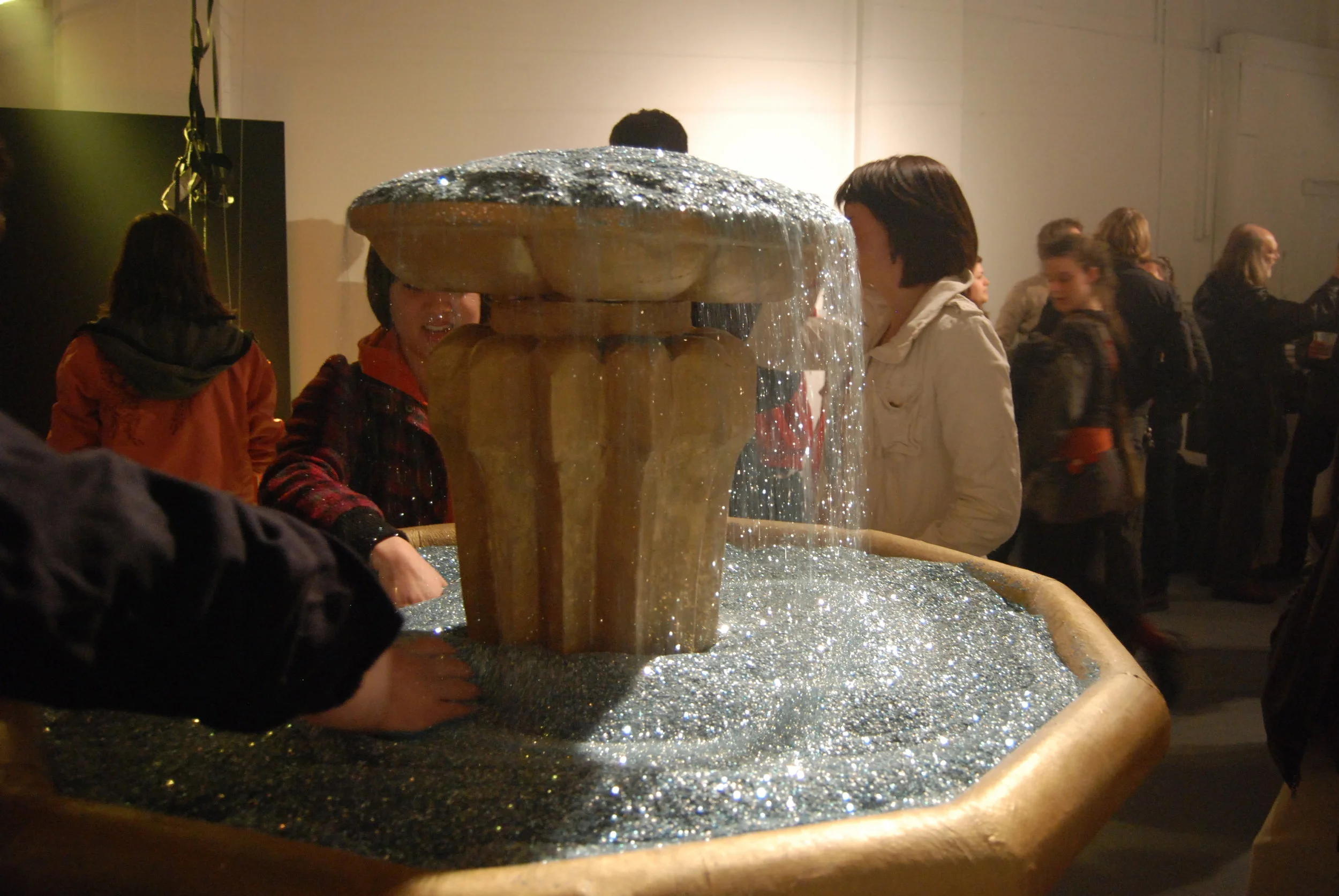  100 pounds of glitter would flow through this handmade fountain. Glitter was pumped up to the top, then cascaded down gently back into the bowl.&nbsp; 