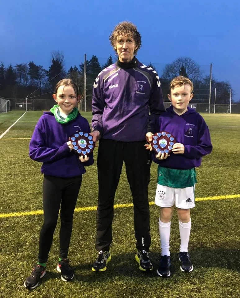 Eobha McAllister and Ethan Buchanan receive their awards from Alistair Bratten