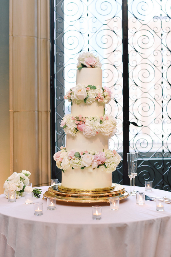 classic white and pink wedding cake.png
