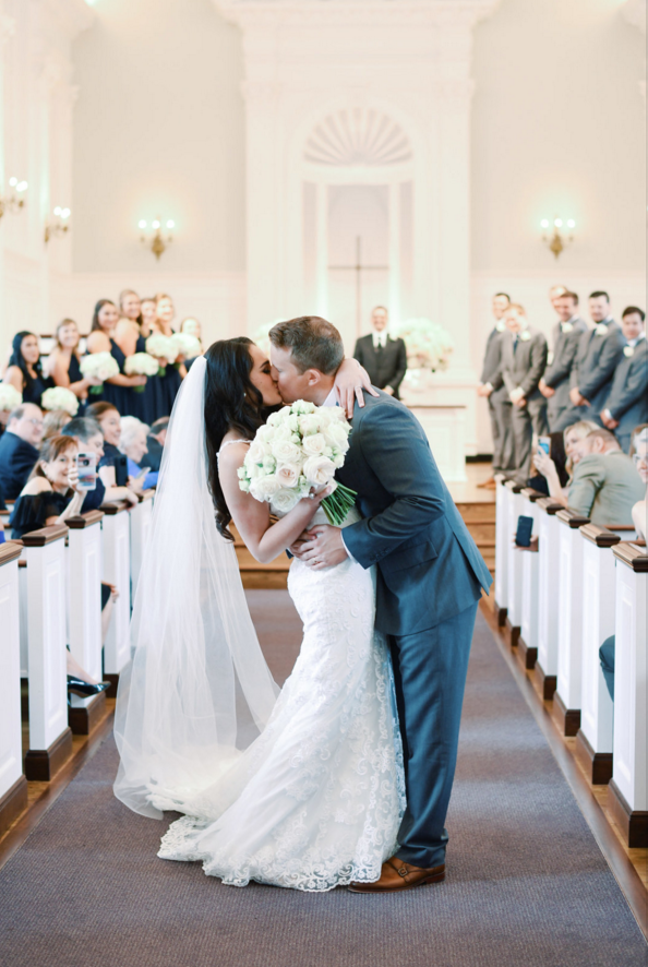 bride and groom ceremony kiss.png