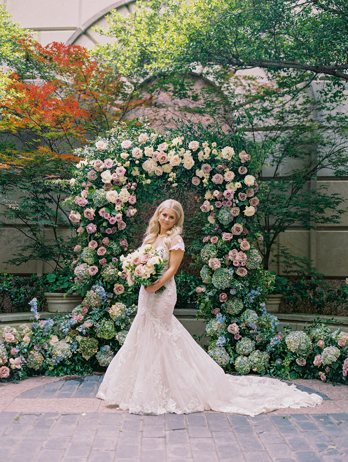 colorful spring wedding ceremony arch florals