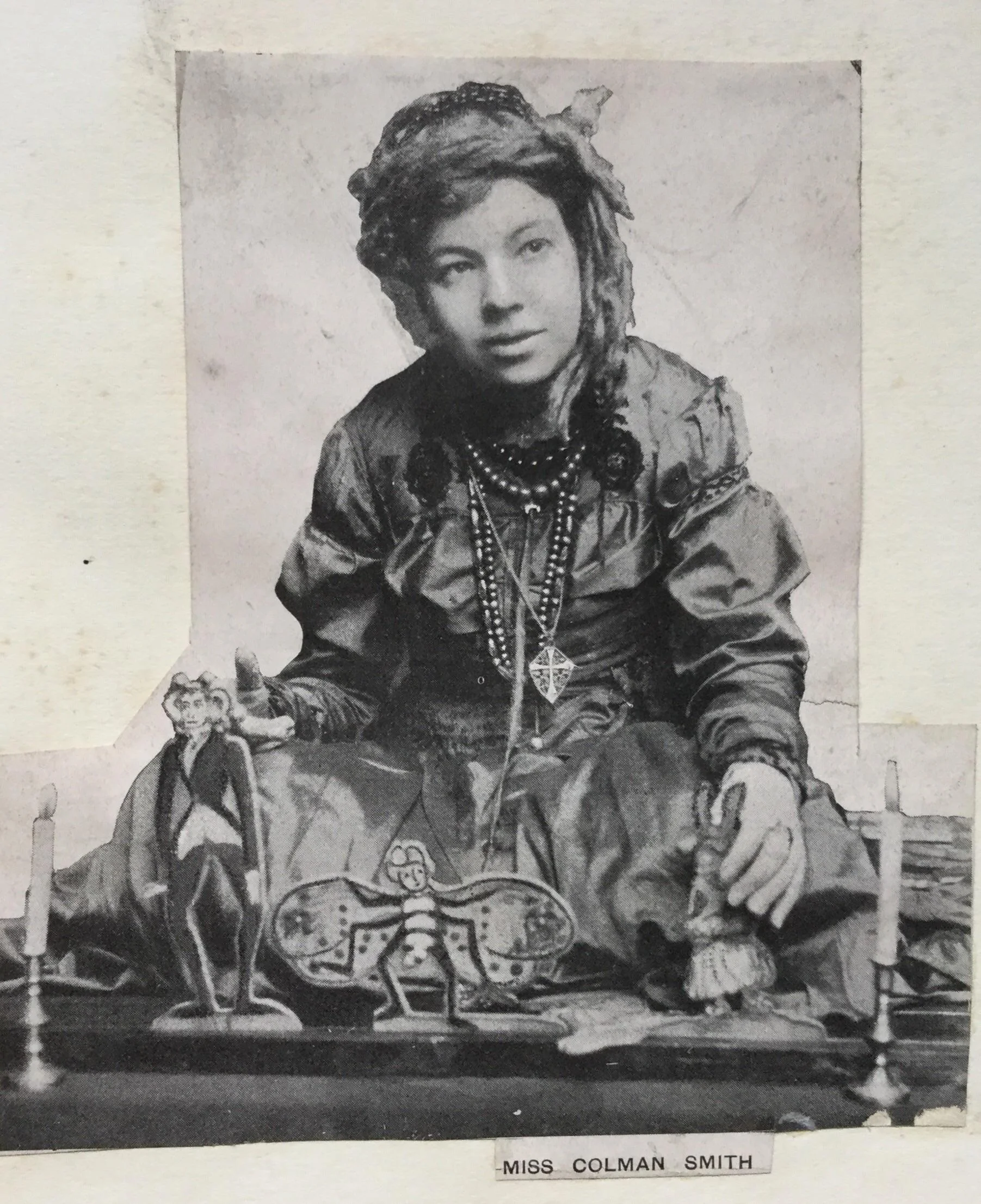 Pamela Colman Smith with some of the simple wooden dolls she used for telling her “Annancy Stories.”