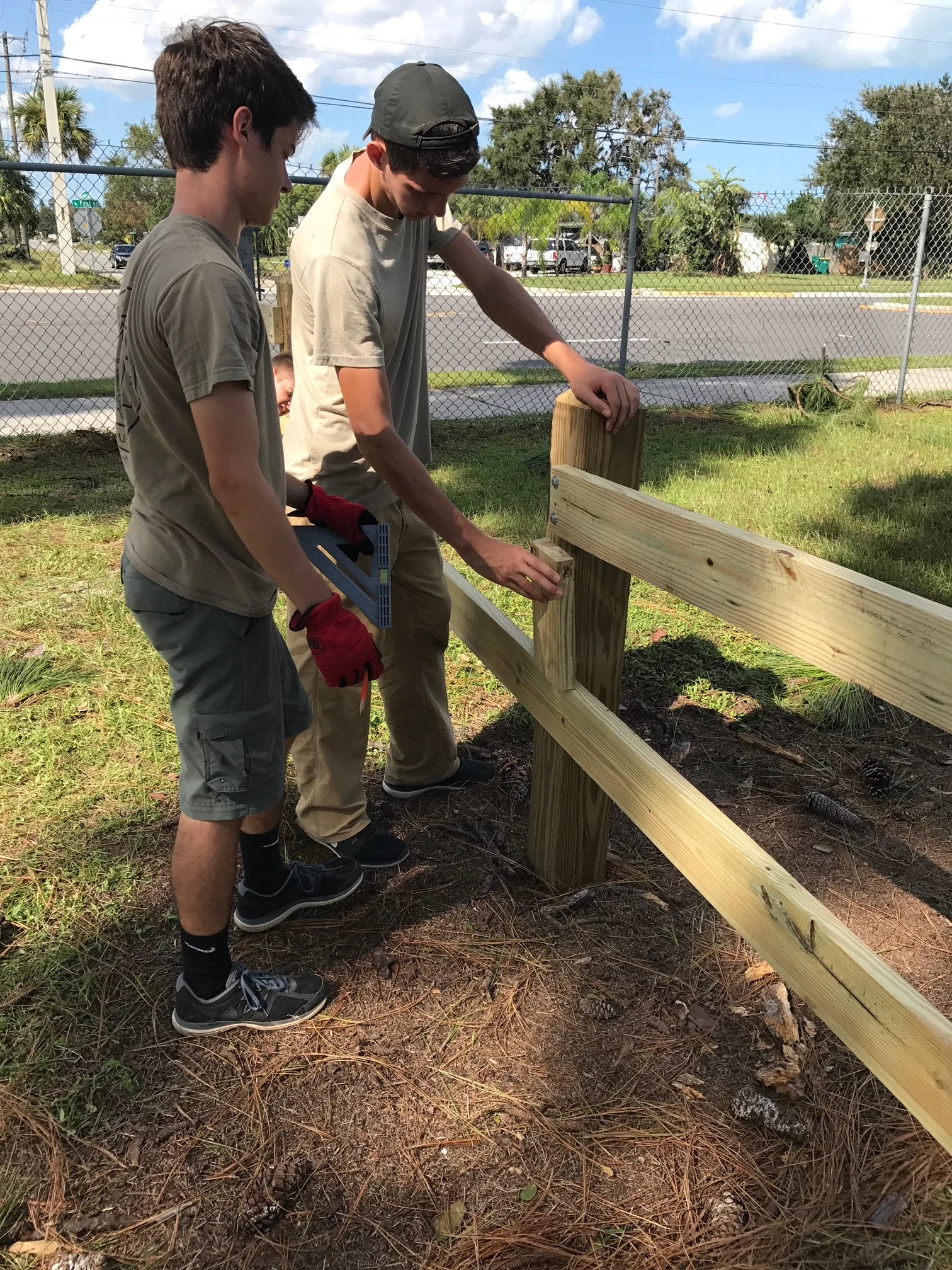 The fence was constructed using treated 6x6 posts, decoratively trimmed, treated 2x7 quality lumber, and weather-proof robust hardware.
