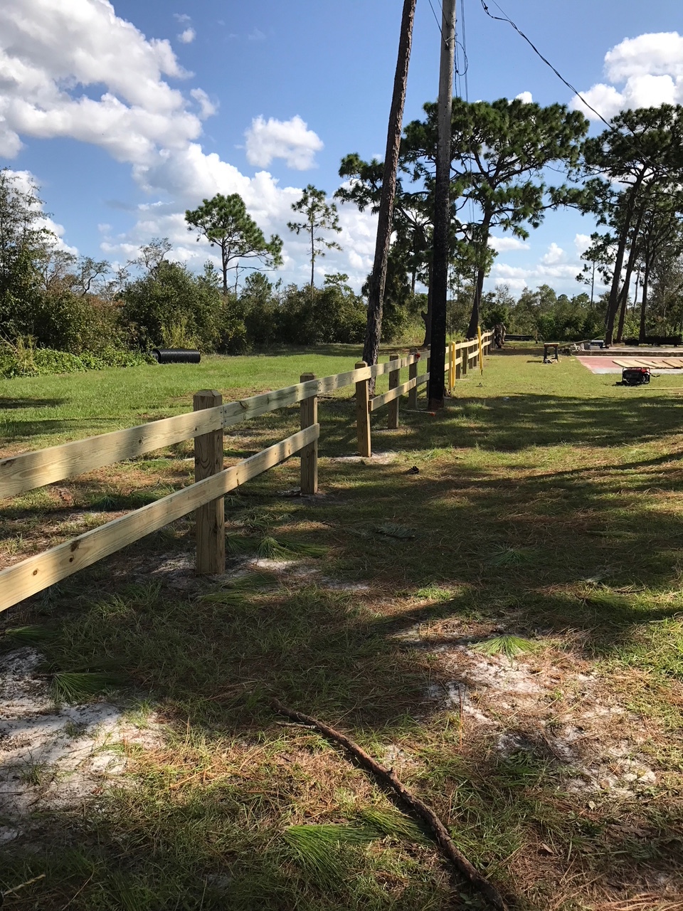 The fence spans the East Side of our property and serves as a decorative delineation between our property and the adjacent Wickham Park woods. An opening was left to allow people to freely pass both ways.