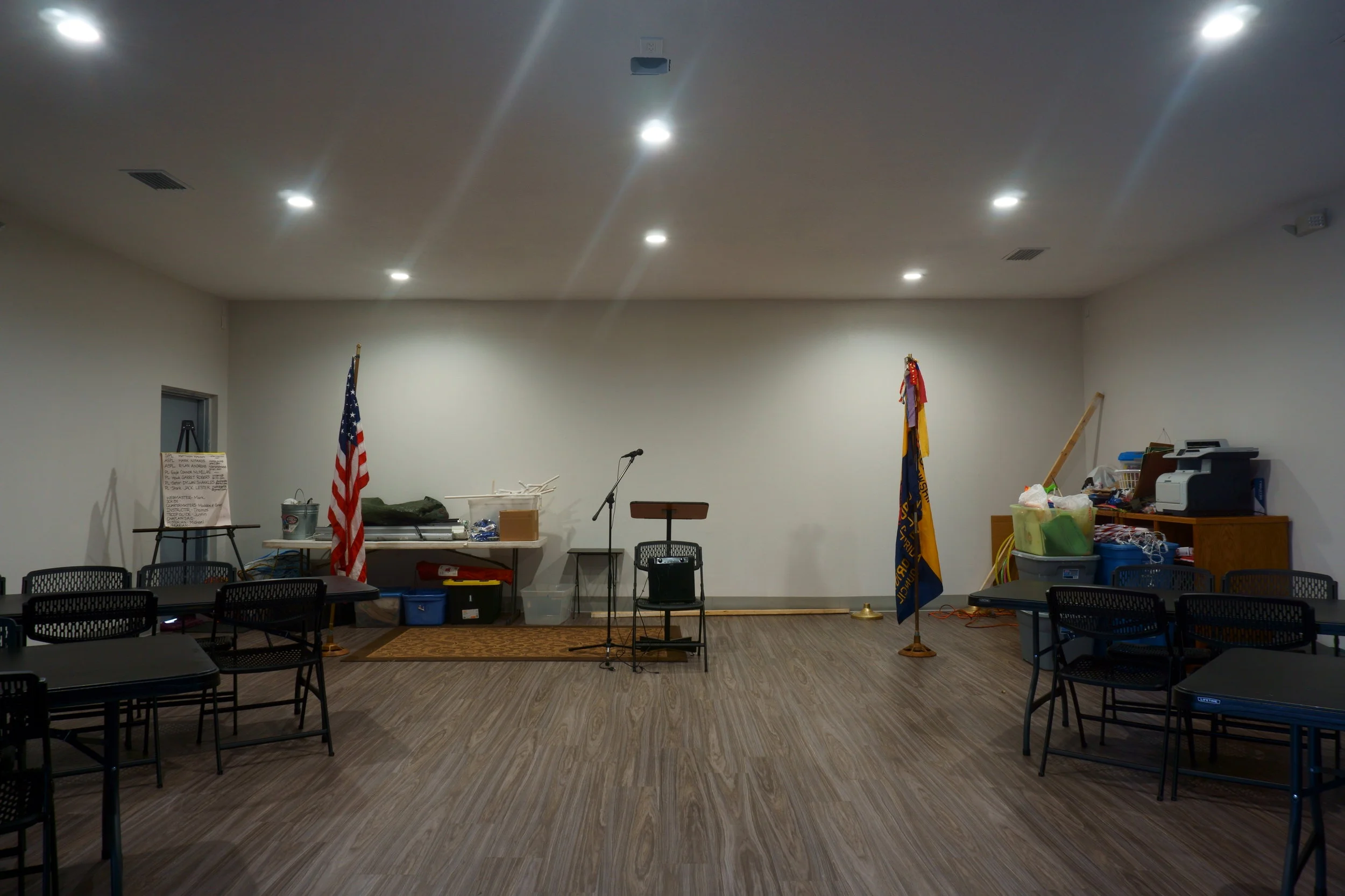 This is a shot of the front stage area with brand-new donated tables and chairs. Our Boy Scout Troop and Cub Scout Pack are now having meetings in here! Everything is new… electrical, lighting, plumbing, sewage, roof, drywall, ceiling, and flooring!