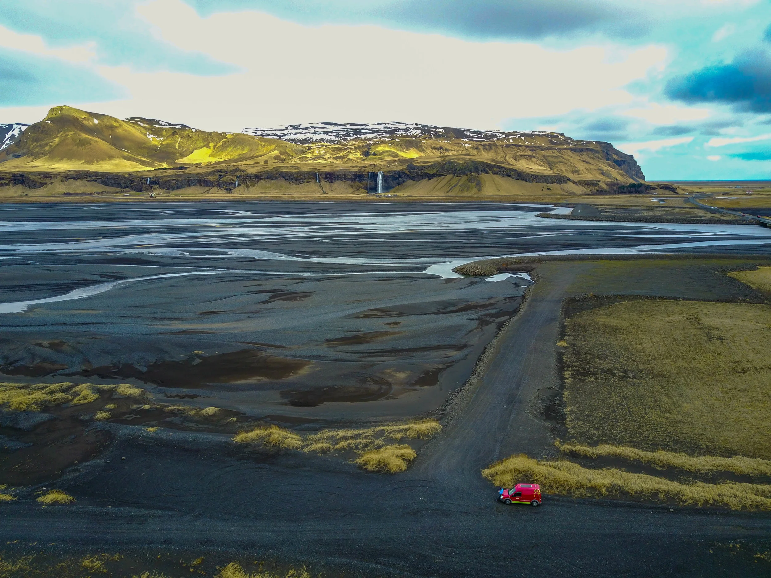 Black sand lagoons and Sejalandsfoss