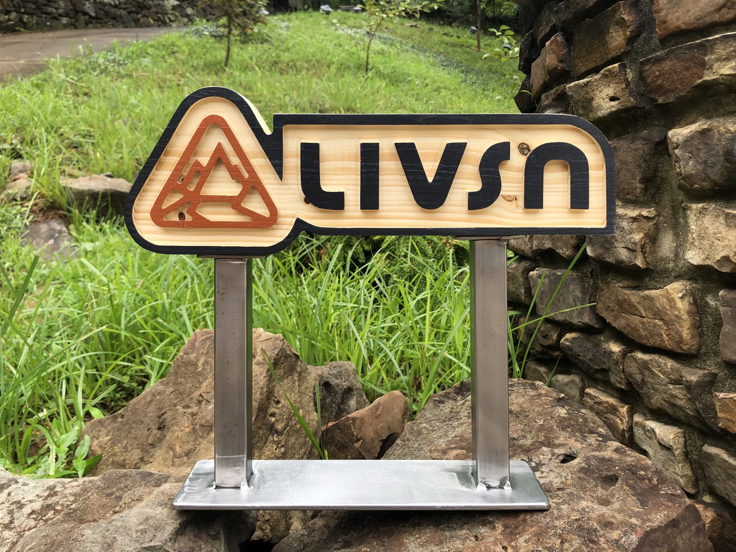 CNC milled logo stand with welded base