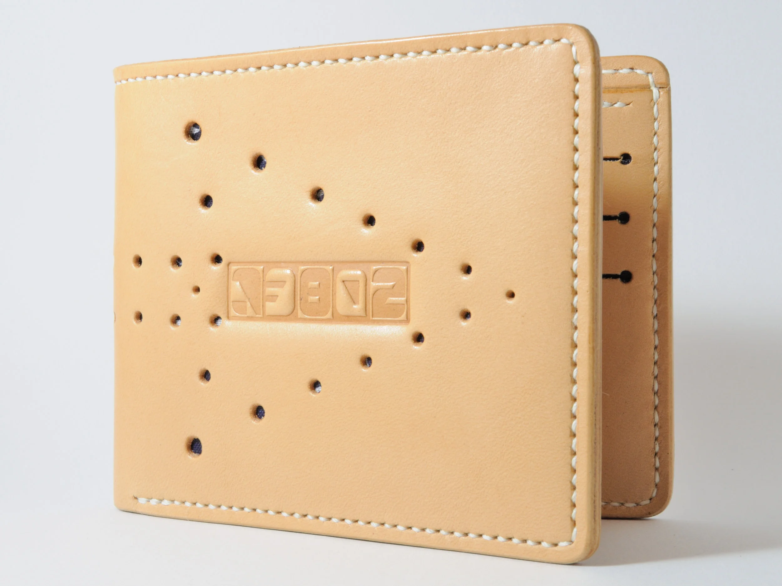 Natural leather w/ arrow hole punched pattern & navy bandanna liner